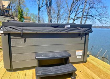 Private hot tub overlooking Wilson Lake at a waterfront vacation rental in Muscle Shoals, Alabama.