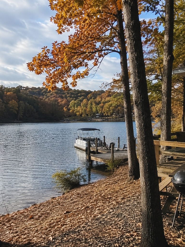 Fall Waterfront Getaway in Athens, Alabama - VLB Properties LLC - VLB Properties LLC Autumn lakeside view at a waterfront vacation rental in Athens, Alabama with colorful fall trees, a private dock, and peaceful lake scenery